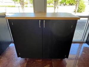 lot 627 image: Large Rolling Storage Cabinet w Butcher Block Top.  Measures 49 x 43 x 25.5