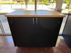 lot 628 image: Large Rolling Storage Cabinet w Butcher Block Top.  Measures 49 x 43 x 25.5