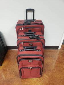 lot 702 image: Lot of 3 Matching Dockers Suitcases