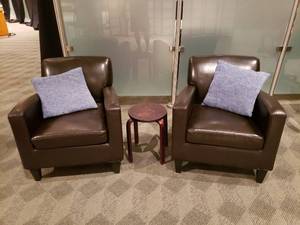 lot 843 image: Lot of 2 Brown Deep Seat Arm Chairs w Pillow & Small Table