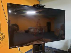 lot 985 image: Magnavox 55 LED 1080P Smart HDTV w Rolling Media Rack.  Model 55MV314XF7