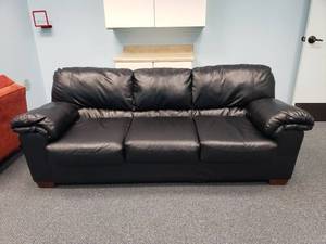 lot 1002 image: Black Sofa w Heavy Padded Arms. 87 Long (Matches Lot 984)