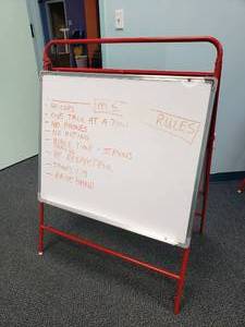 lot 1090 image: Excellerations Multi-Use Double Sided Learning Easel.  Dry erase on one side, felt on the other.