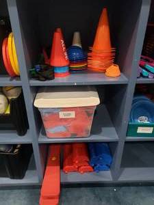 lot 1214 image: Contents of Shelf.  Lot of Misc Cones, Inflatable Bunkers, Sensory Balance Beams & Step Toss Games