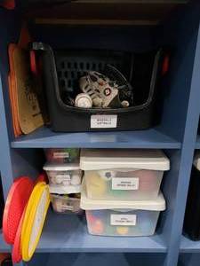 lot 1216 image: Contents of Shelf.  Misc Baseballs, Glove, Tennis Raquets & Sponge Balls.