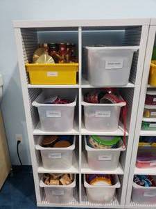 lot 1285 image: Large Lot of Misc Kids Instruments.  Cymbals, Bongo Drums, Tamborines, Snare Drums, Clappers & More.  SHELF NOT INCLUDED.