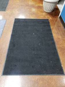 lot 1438 image: Black Cintas Entrance Mat.  67 x 43