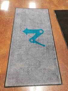 lot 1440 image: Grey Entrance Mat w LifePoint Logo.  68 x 33
