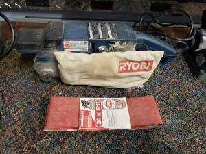 lot 1515 image: Ryobi Model BE321T2 Belt Sander w Extra Belts
