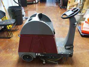 lot 1408 image: Minuteman E-Ride 21 Compact Riding Floor Scrubber