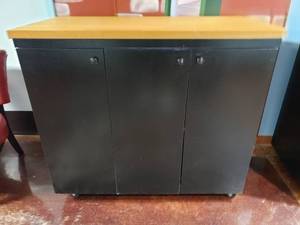 lot 1609 image: Large Rolling Storage Cabinet w Butcher Block Top.  Measures 49 x 43 x 25.5