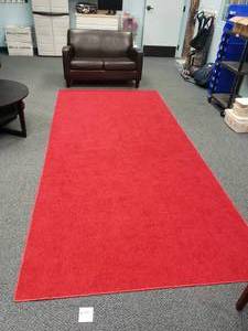 lot 1671 image: Red Area Rug.  Measures 141 x 66