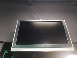 lot 1839 image: Westinghouse Wall Mounted TV.  Buyer to remove.