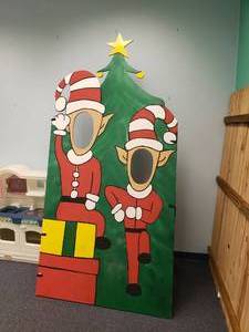 lot 1856 image: Christmas Elves Wooden Cutout Face Picture Board
