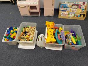 lot 1862 image: 4 Totes of Misc Play Items.  Duplo, Wooden Blocks, Animals, Water Guns & More