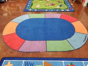 lot 1877 image: Large Oval Classrom Area Rug.  106 x 72