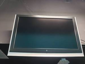 lot 1768 image: Westinghouse Wall Mounted TV.  Buyer to remove.