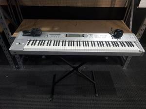 lot 78 image: Korg Triton LE 61 Key Workstation Keyboard Synthesizer w Stand & Power