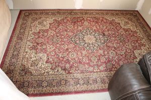 lot 10 image: Red area rug - 52 x 76