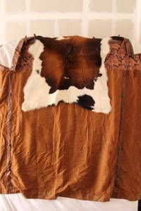 lot 19 image: Cowhide rug and faux leather shower curtain