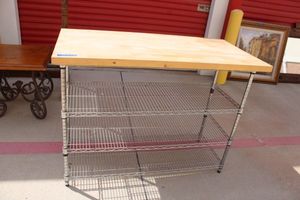 lot 26 image: Metal shelf rack with wood cutting board  top - 50W x 25D x 38H