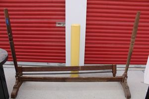 lot 22 image: Vintage wooden clothes rack with wooden wheels