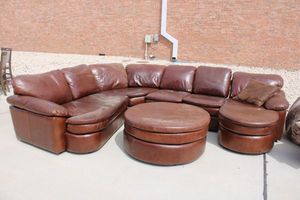 lot 32 image: Large Leather Sectional Couch with Ottoman