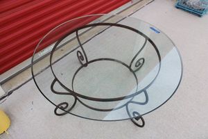 lot 62 image: 42 Round Glasstop Table with metal base