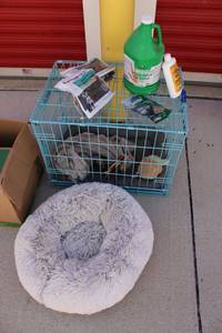 lot 42 image: Dog cage, fluffy dog bed, horse gel, dog treats, and wheat germ oil blend