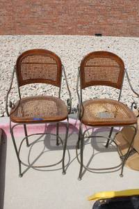 lot 49 image: Pair of cane seat bar chairs. Iron frames (one seat needs repair)
