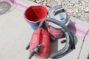 lot 54 image: Shop-vac 6 Gal., plastic gas can 5 Gal. and buckets
