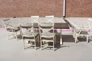 lot 60 image: Metal patio table with wood look and 6 Chairs with cushions