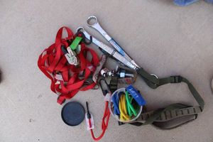 lot 74 image: Ball Hitch 1-14&1-12 Wrenches, Straps, 2 Hitch Ball, and small Bungee cords