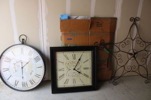 lot 84 image: Large wall clocks and large decorative metal star