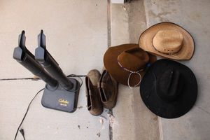 lot 75 image: Cabelas boot dryer, Mens waterproof work boots size 11, cowboy hats, see photos.