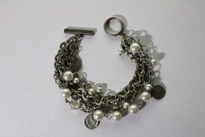 lot 108 image: Signed 5-strand mixed chain bracelet with pearl accents and American Eagle branded bar toggle clasp. 7.5L