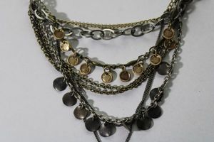 lot 110 image: Signed American Eagle Outfitters mixed metal chain necklace. Has AEO hang tag. 16L with 2 extender