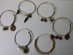 lot 115 image: (6) Signed Alex and Ani (2004-2023) expandable bangle charm bracelets with double sided charms and sliding mechanism. All marked Alex and Ani.