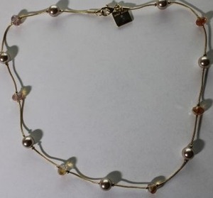 lot 118 image: Signed vintage Anne Klein pink pearl station necklace. 16L. Has Anne Klein hang tag.
