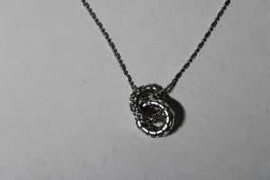 lot 127 image: Signed Brighton ball and bead chain necklace with interlocking rings pendant. 14L with 2 extender. Has script B heart shaped hang tag and heart shaped clasp.