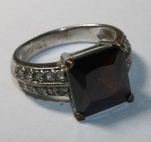 lot 132 image: Signed Chapel Zenray Garnet glass ring. Marked NF (Chapel-Zenray Co, Thailand). Size 7. Needs cleaned