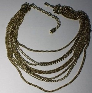 lot 141 image: Signed Coro 9-strand gold tone metal chain necklace. Marked Coro on shepherd crook clasp. 12-18L with 3 extender.