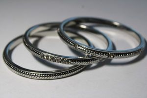 lot 142 image: (3) Signed Ann Taylor (1954- )heavy matching bangle bracelets. Rope and crystal design. Marked Ann Taylor inside.