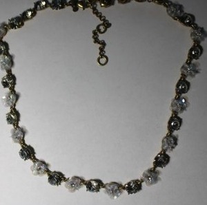 lot 144 image: Signed Ann Taylor faceted crystal flower necklace. Marked Ann Taylor on hang tag. 16L with 2 extender.