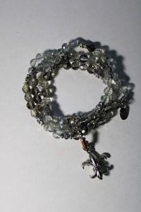 lot 146 image: Signed Set of 3 matching faceted glass bead stretch bracelets with ball bead connector with fleur de Lis charm. Marked Cookie Lee on hang tag.