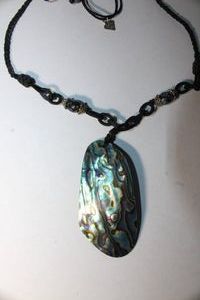 lot 147 image: Signed Cookie Lee woven necklace with large Abalone ShellPua Shell pendant. Marked Cookie Lee on hang tag. Adjustable 22L with pull adjust. Pendant 3L