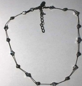 lot 151 image: Signed Dabby Reid (New York) faceted Swarovski Crystal and grey metal bead station necklace. Marked Dabby Reid on hang tag. 16L with 2 extender.