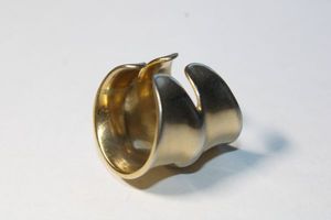 lot 155 image: Signed DanniJo (Florida, 2008 - ) 14K gold plated Jacinda double concave ring. Size 6.5 Retails at $115