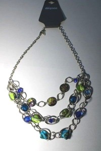 lot 157 image: Signed Dauplaise (Stein Mart) freeform colored shell and faceted glass bead necklace 18L On hang card. Lobster clasp.