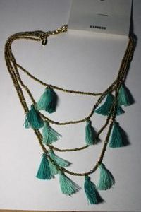 lot 160 image: Signed Express tassel necklace on hang card. Marked with Express hang tag. 9-12L